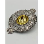 Continental white metal tea strainer with gilt centre