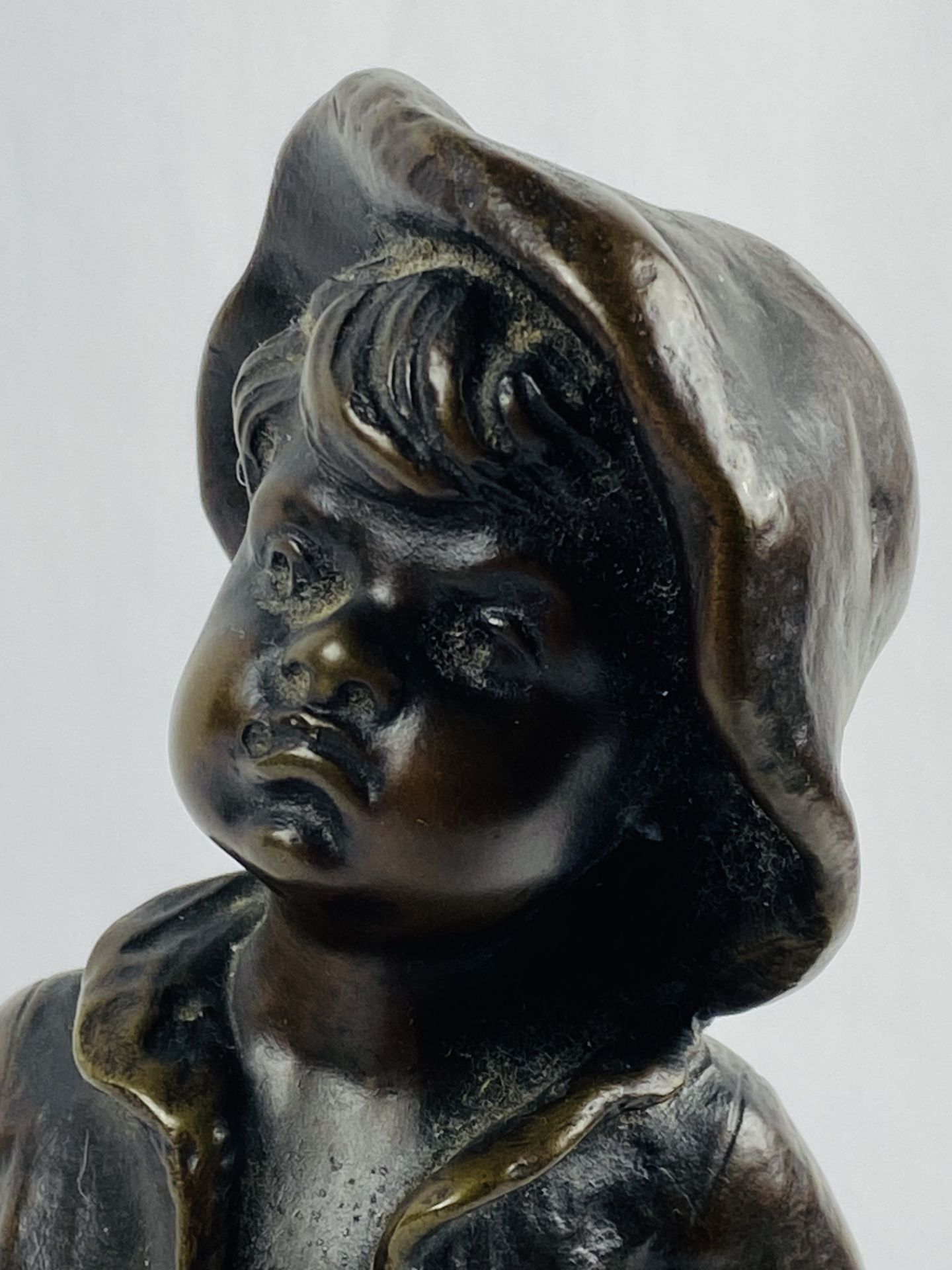Bronze figure of a boy with hands in his pockets, signed to base L Kley - Image 7 of 7