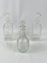 Two cut glass decanters together with a moulded glass decanter
