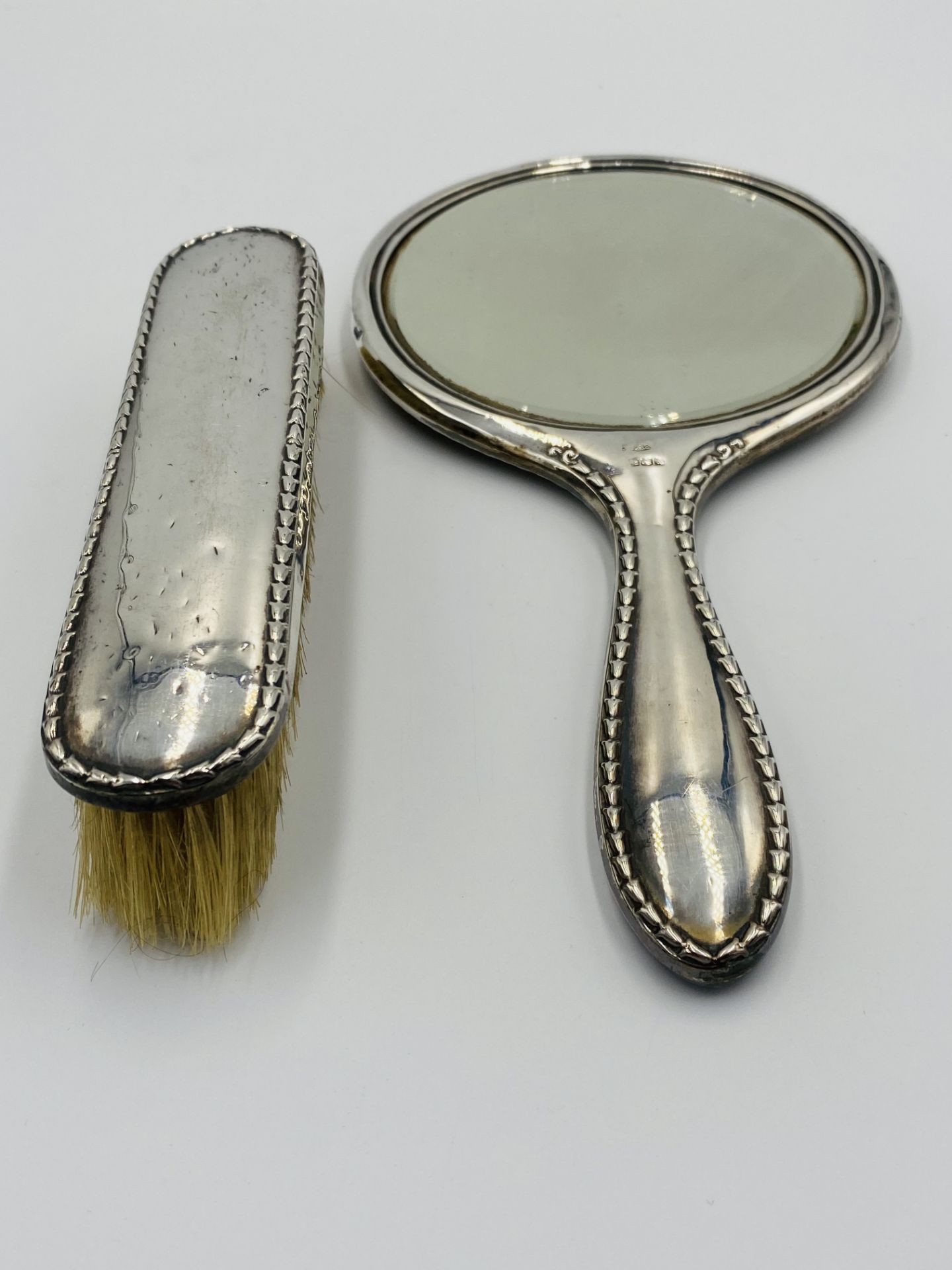 Silver backed dressing table mirror and brush