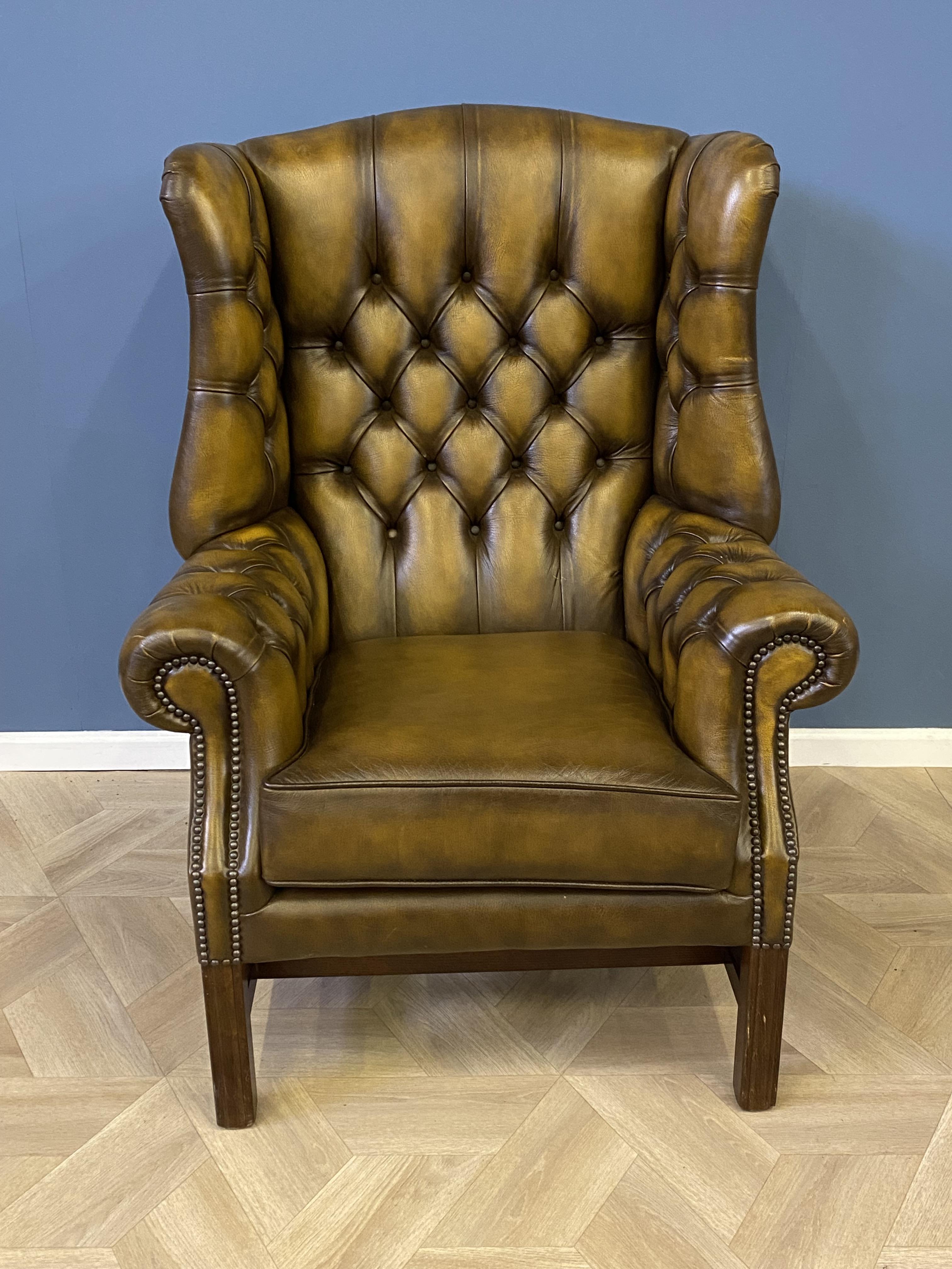 Leather button back wing armchair