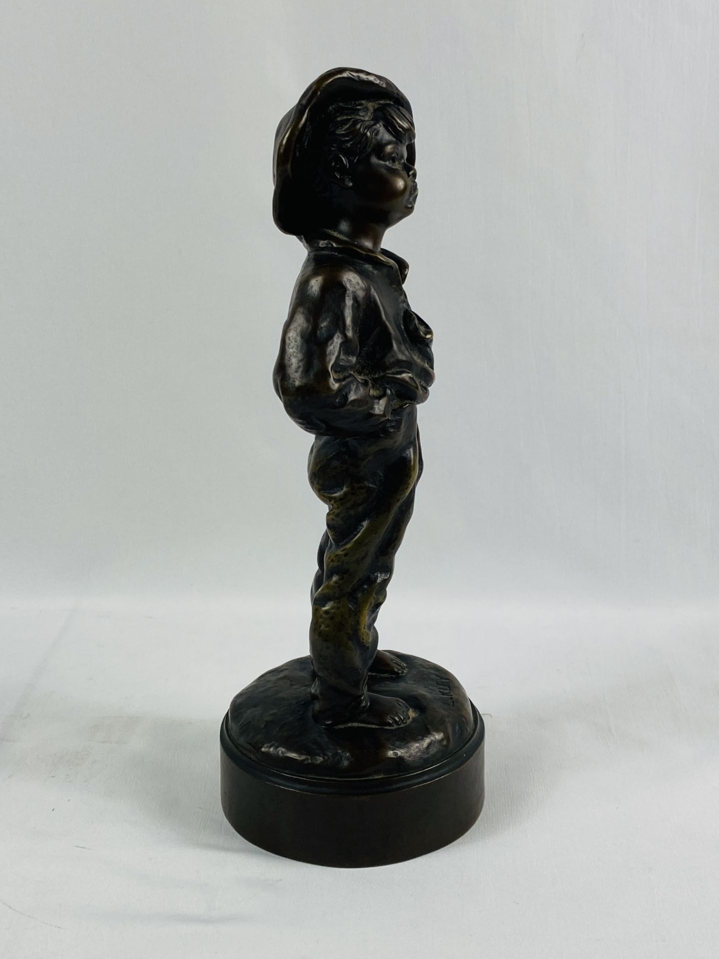 Bronze figure of a boy with hands in his pockets, signed to base L Kley - Image 4 of 7