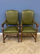 Pair of green leather open armchairs