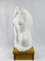 Marble sculpture of female nude torso with signature