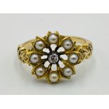 18ct gold ring set with central diamond and seed pearl surround