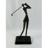 Signed bronzed metal figure of a female golfer on stand