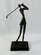 Signed bronzed metal figure of a female golfer on stand