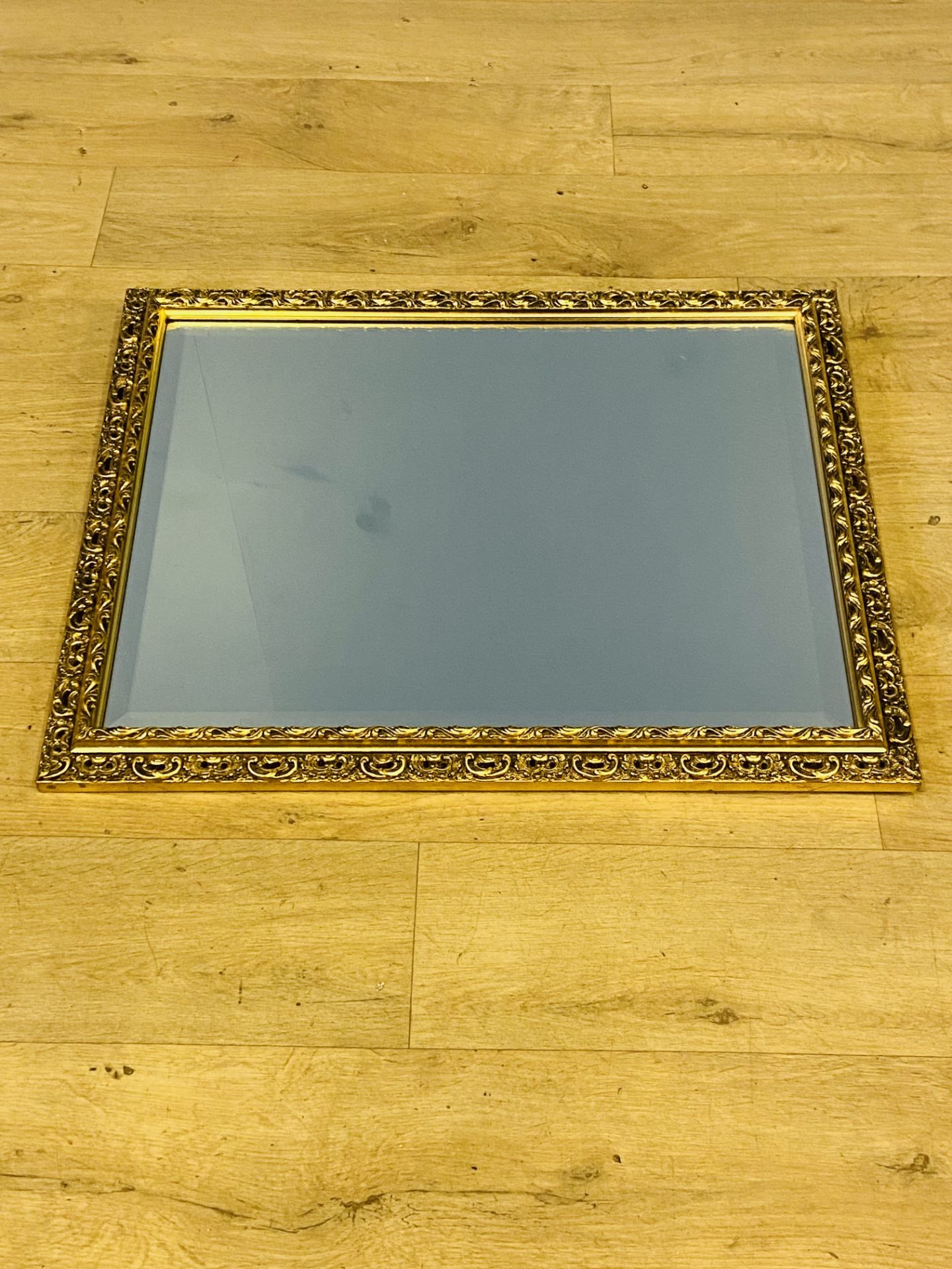 Gilt framed wall mirror