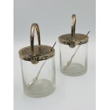 Pair of silver mounted, glass preserve jars with star cut bases