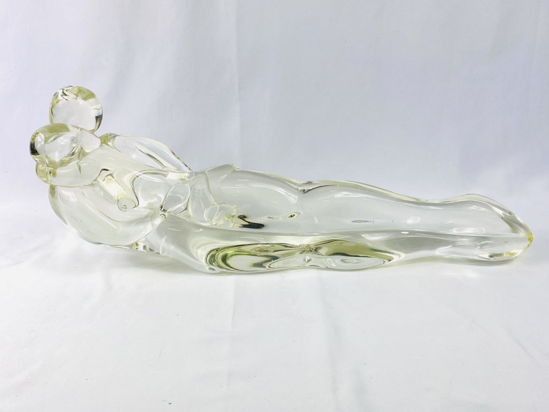 Glass sculpture of reclining lovers