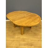 Oak circular dining table with leaf extension