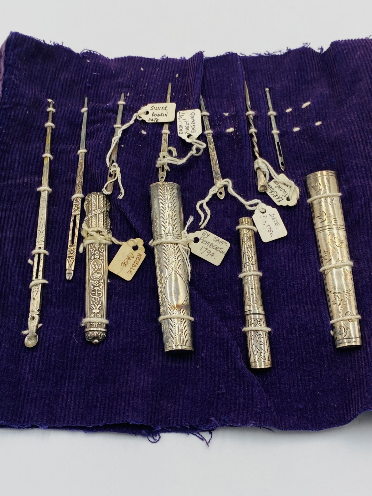 A collection of silver needle cases and bodkins