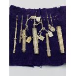 A collection of silver needle cases and bodkins