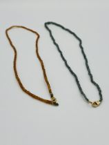 Two beaded necklaces with 14ct gold clasps