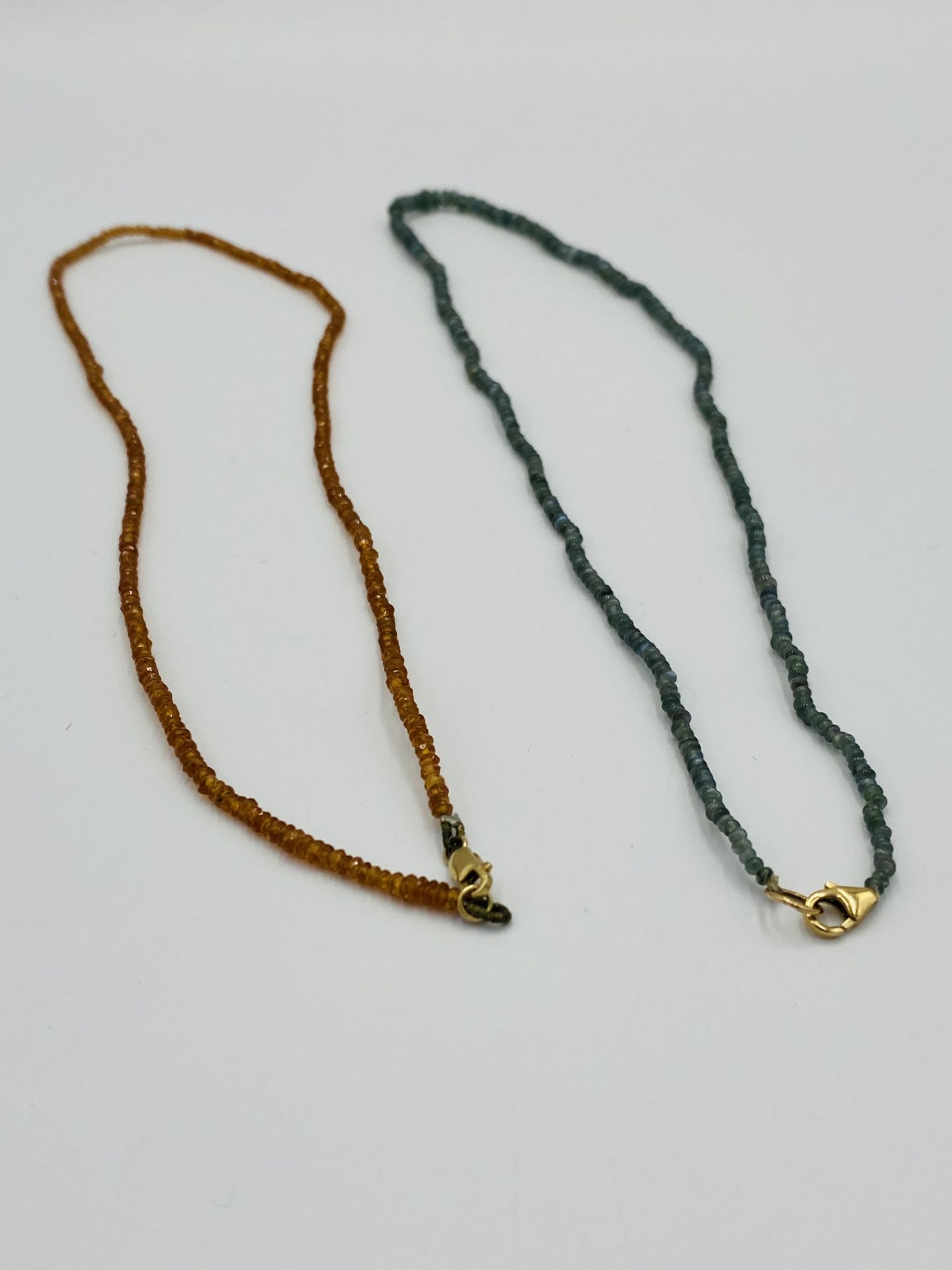 Two beaded necklaces with 14ct gold clasps