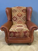Contemporary leather and fabric upholstered armchair