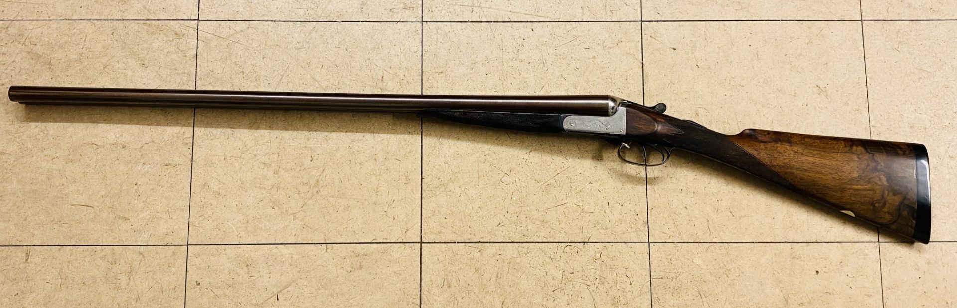 Gregson 12 bore side by side shotgun with 'Damascus' barrels.