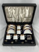 Porcelain part coffee set with silver spoons