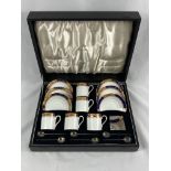 Porcelain part coffee set with silver spoons