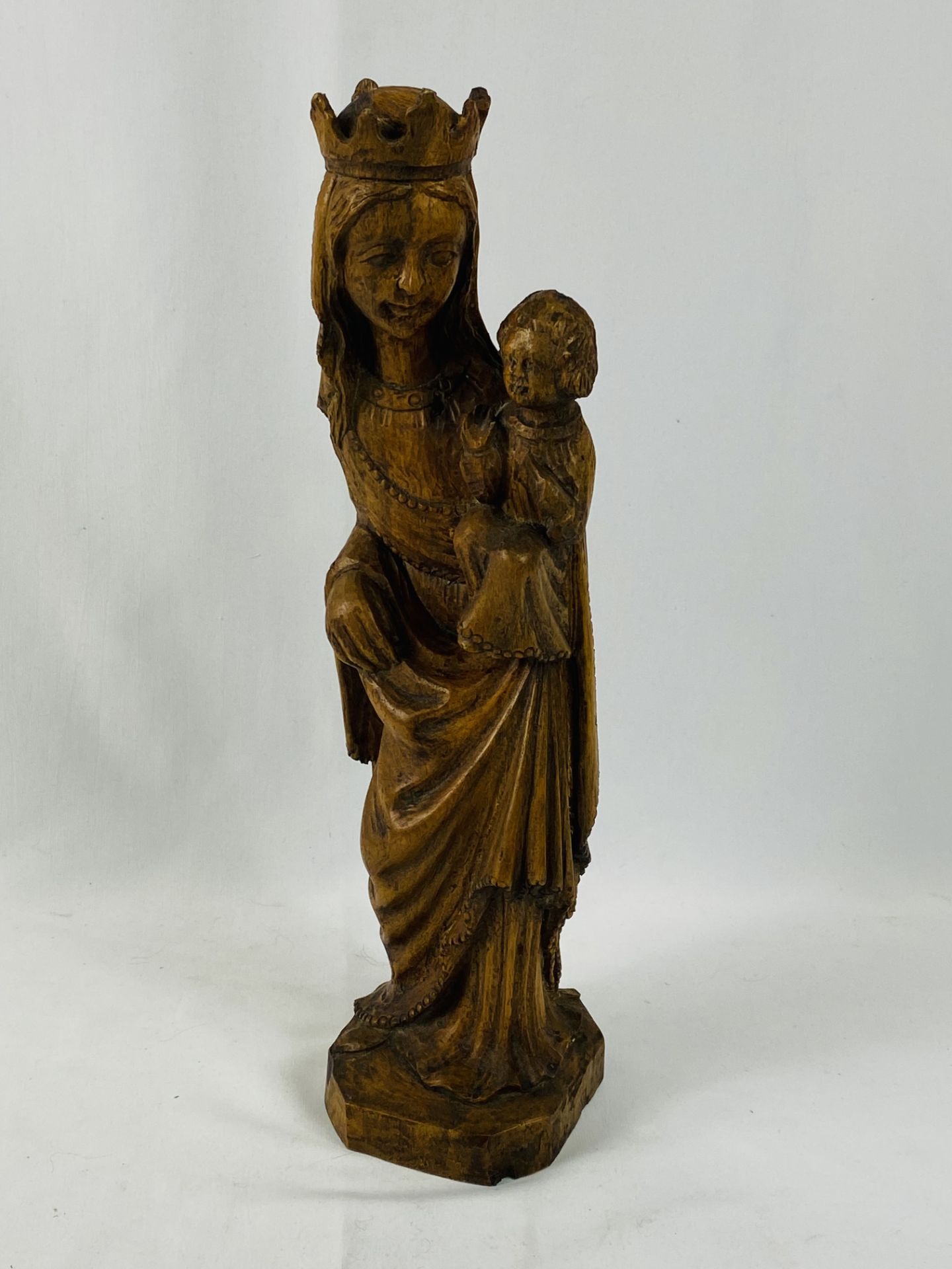 Carved wood figure of a female saint