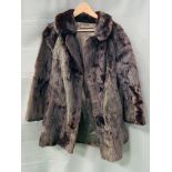 Ladies mink coat together with a fur stole
