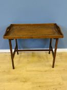 Carved mahogany tray top table