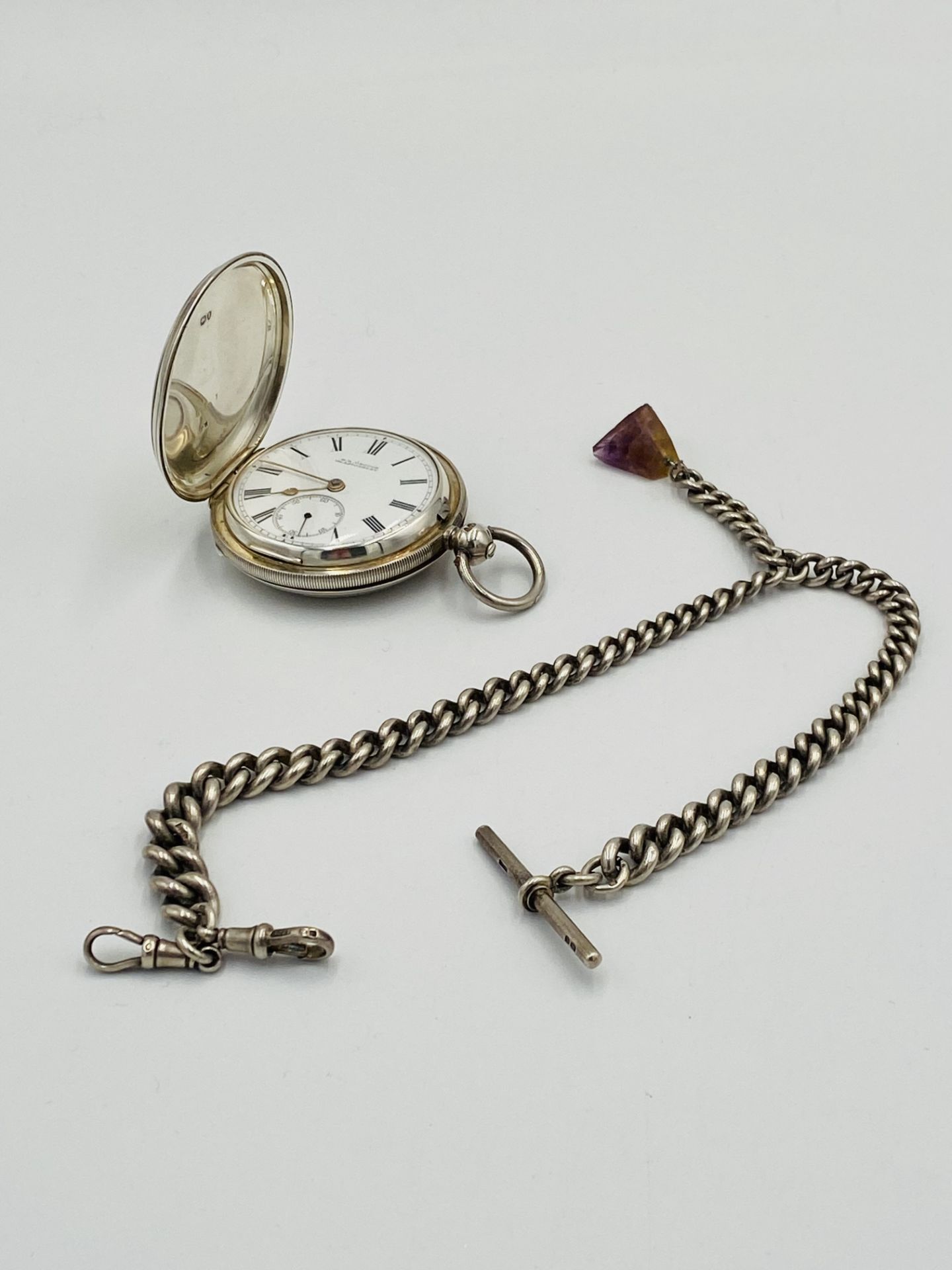 Victorian silver pocket watch together with a silver fob chain