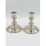 Pair of weighted silver candlesticks