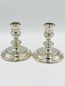 Pair of weighted silver candlesticks