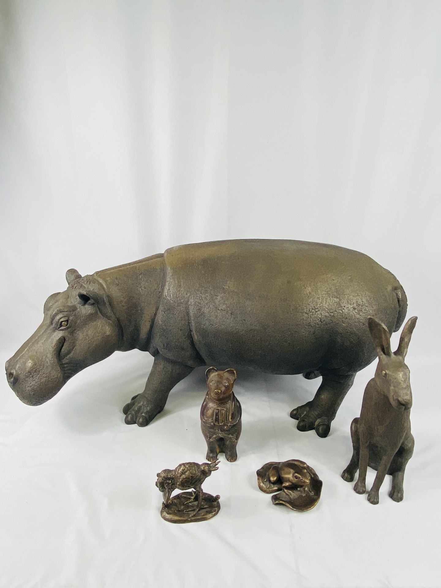Large decorative resin hippo together with other resin animals