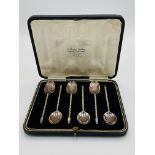Six silver teaspoons with spiral handle, in fitted box,