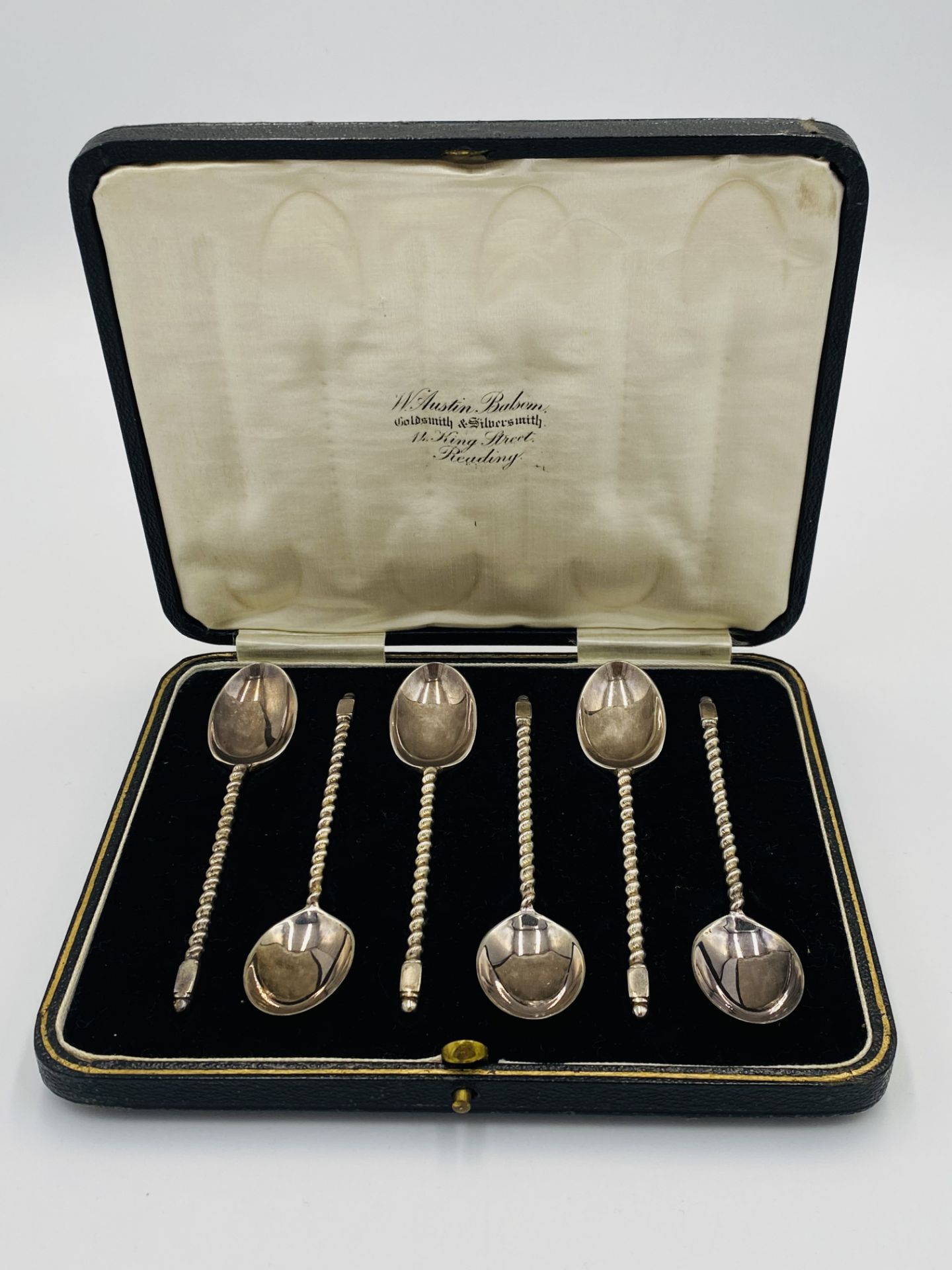 Six silver teaspoons with spiral handle, in fitted box,