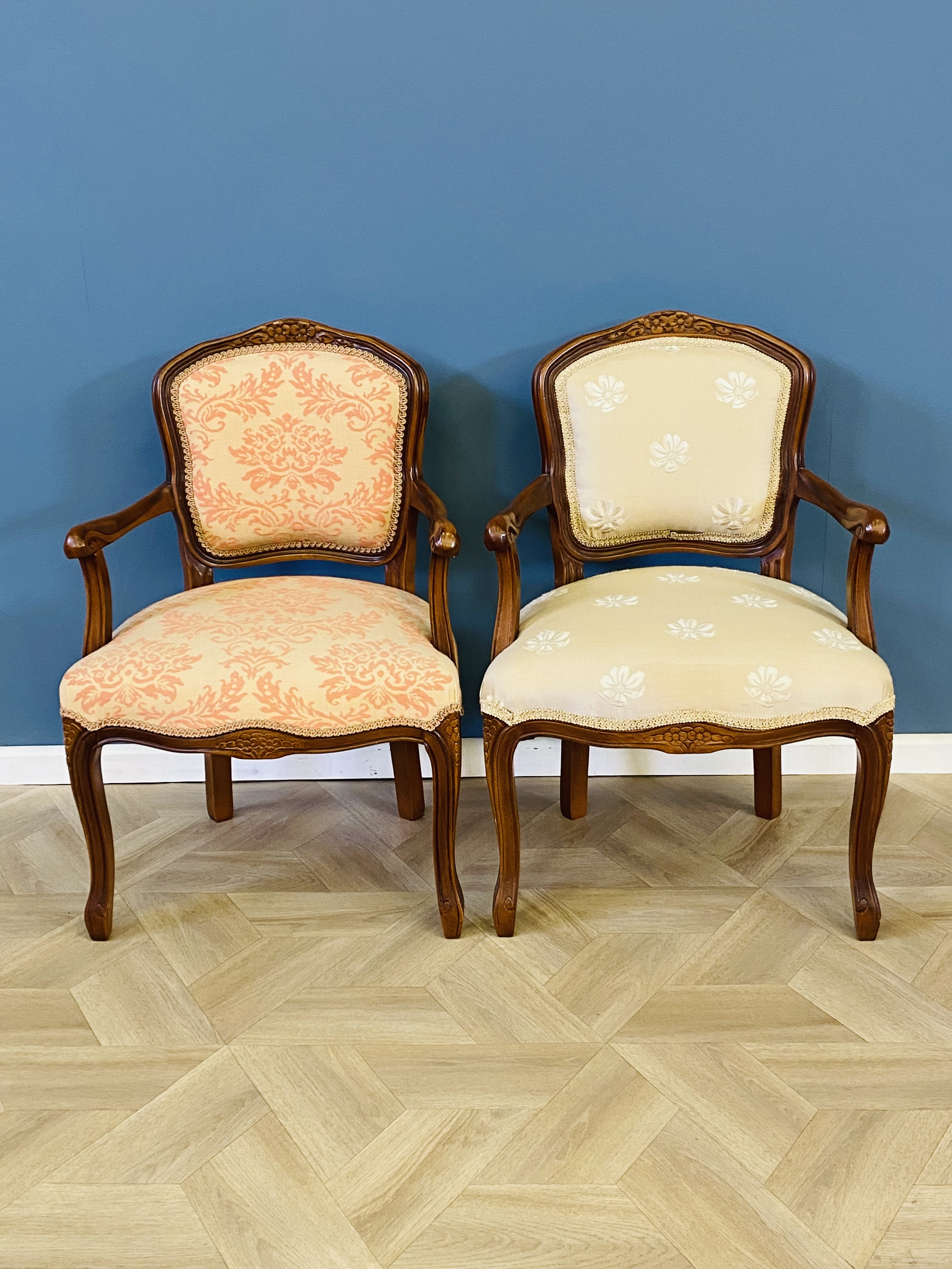 Pair of reproduction French style upholstered elbow chairs