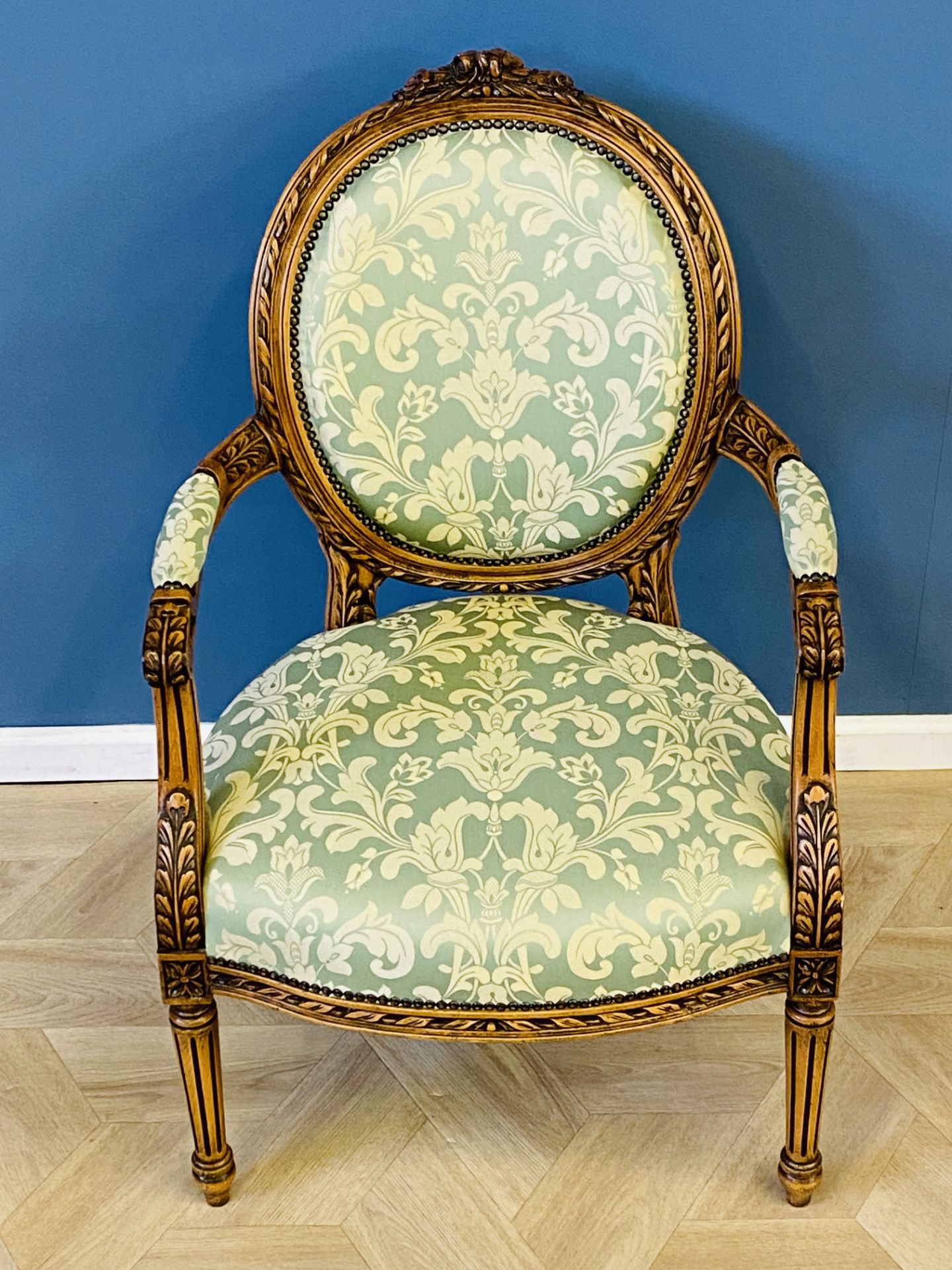 Carved French style open armchair