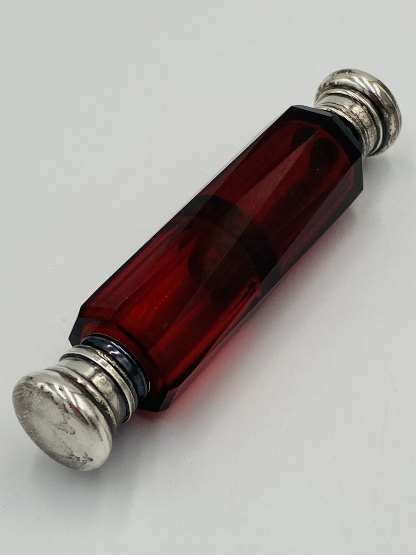 Ruby glass double ended perfume bottle with white metal tops