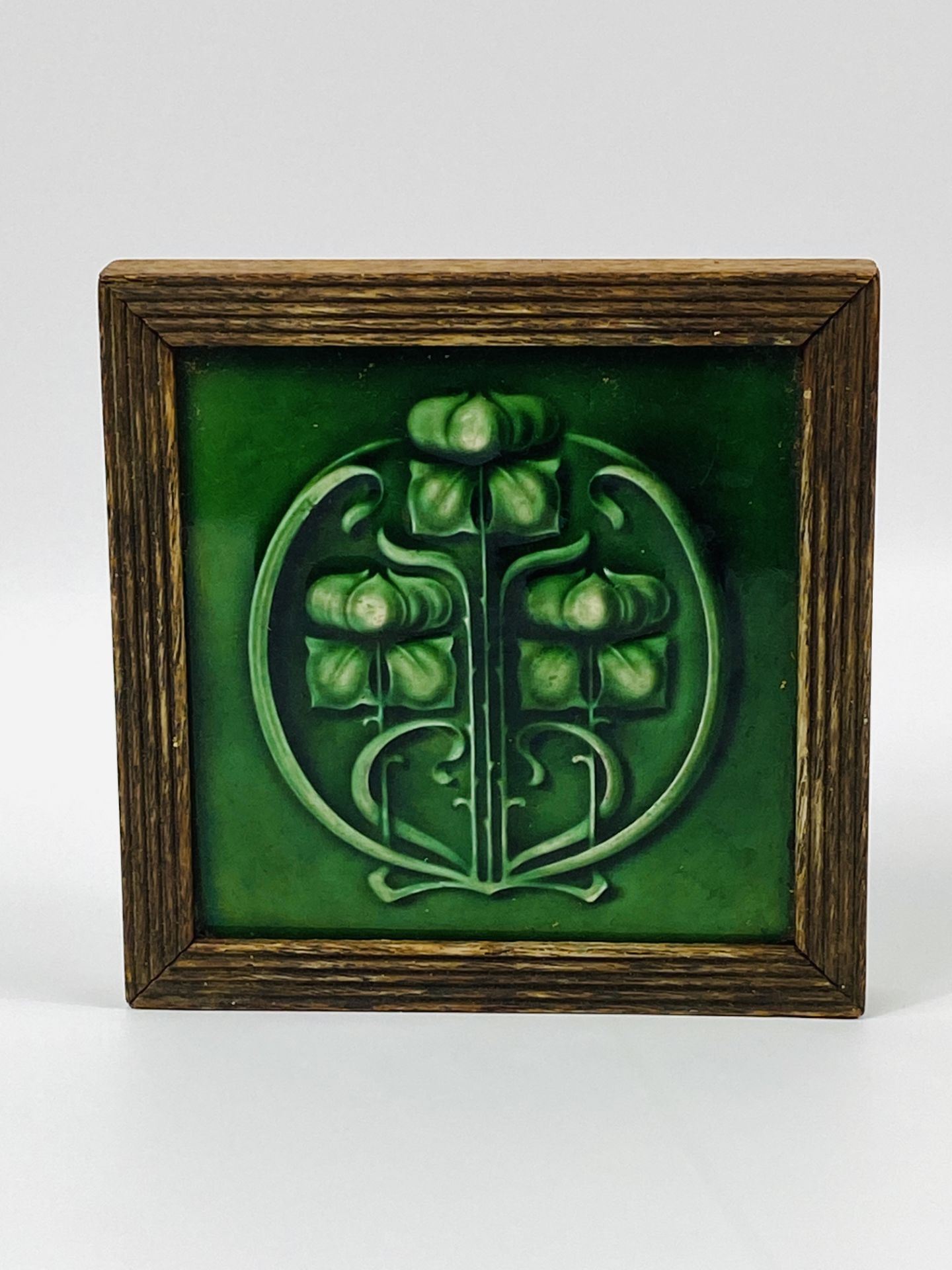 Art nouveau tile in wood frame