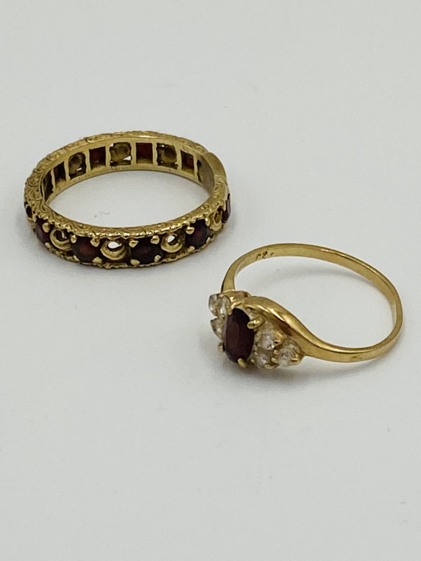 9ct gold ring set; together with yellow metal eternity ring