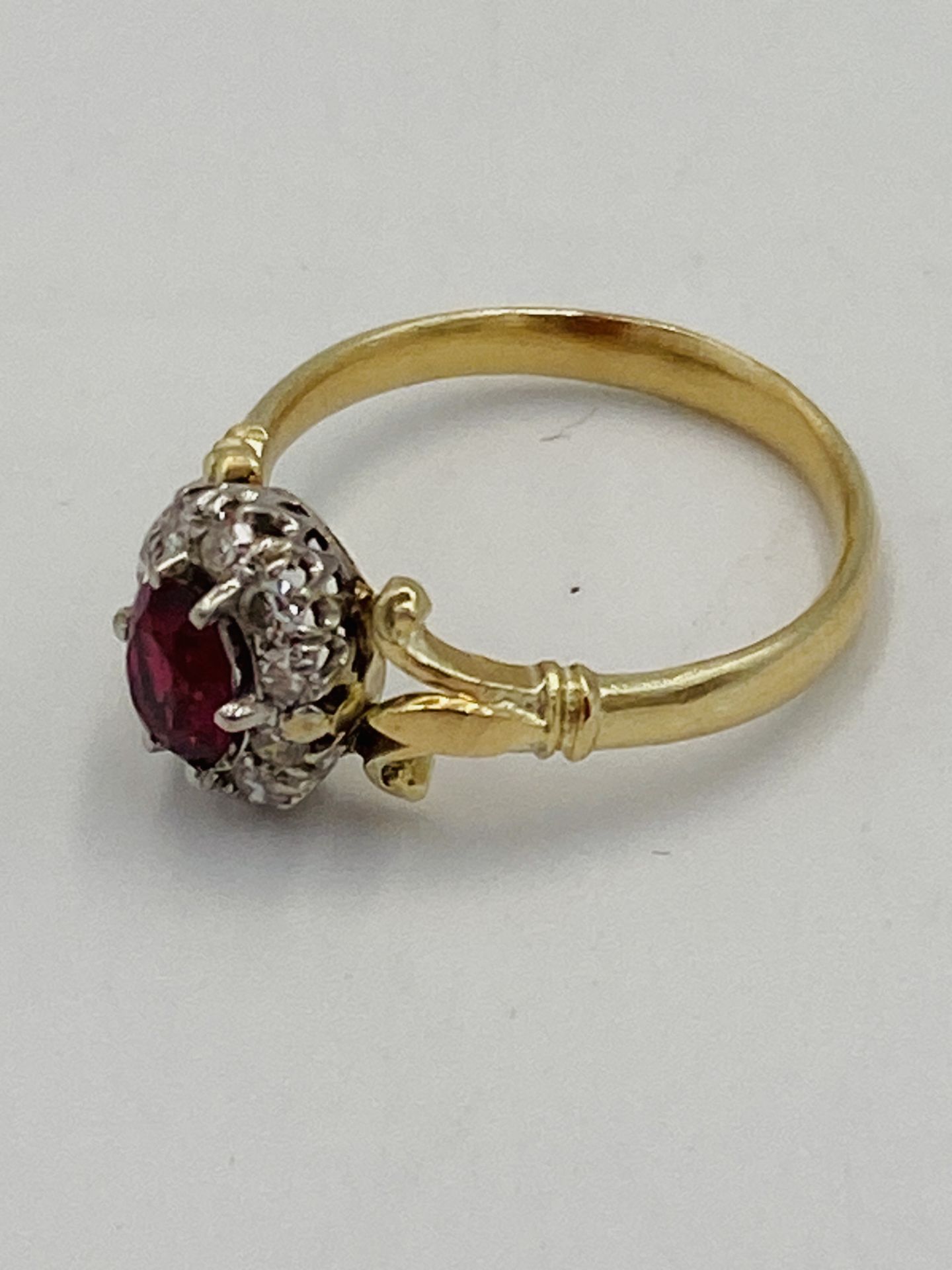 Gold ring set with central ruby and diamond surround - Image 3 of 6