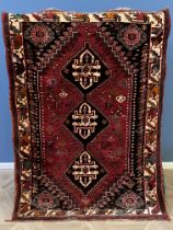 Red ground wool rug