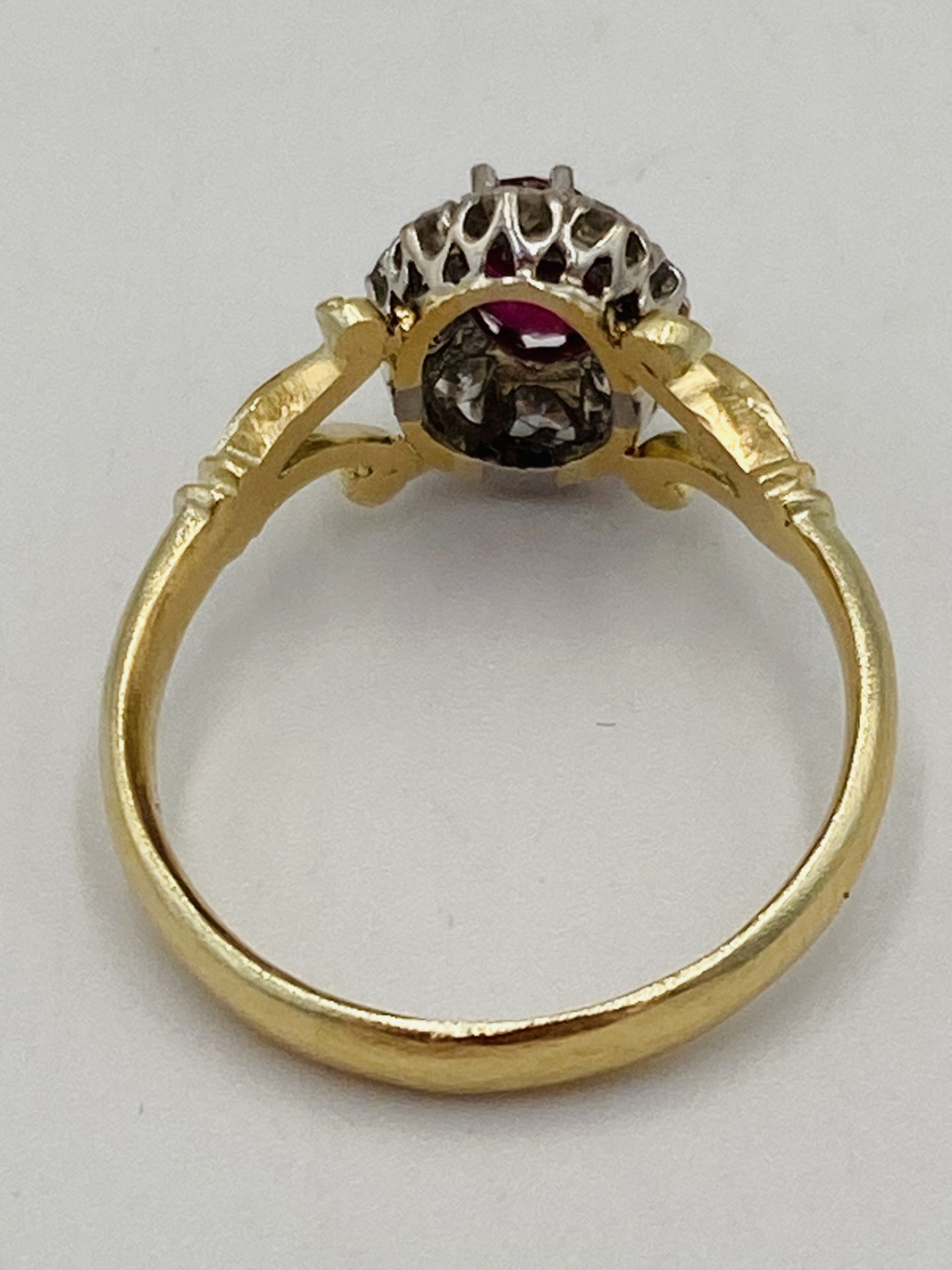 Gold ring set with central ruby and diamond surround - Image 6 of 6