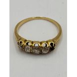 Gold ring set with four diamonds