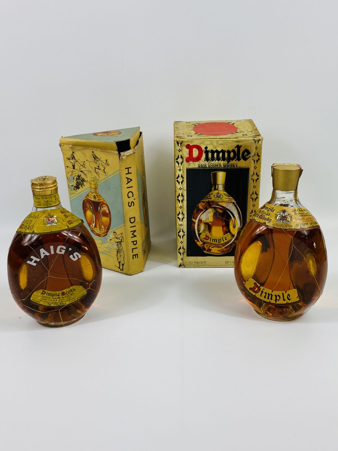 Two bottles of Dimple Scotch whisky