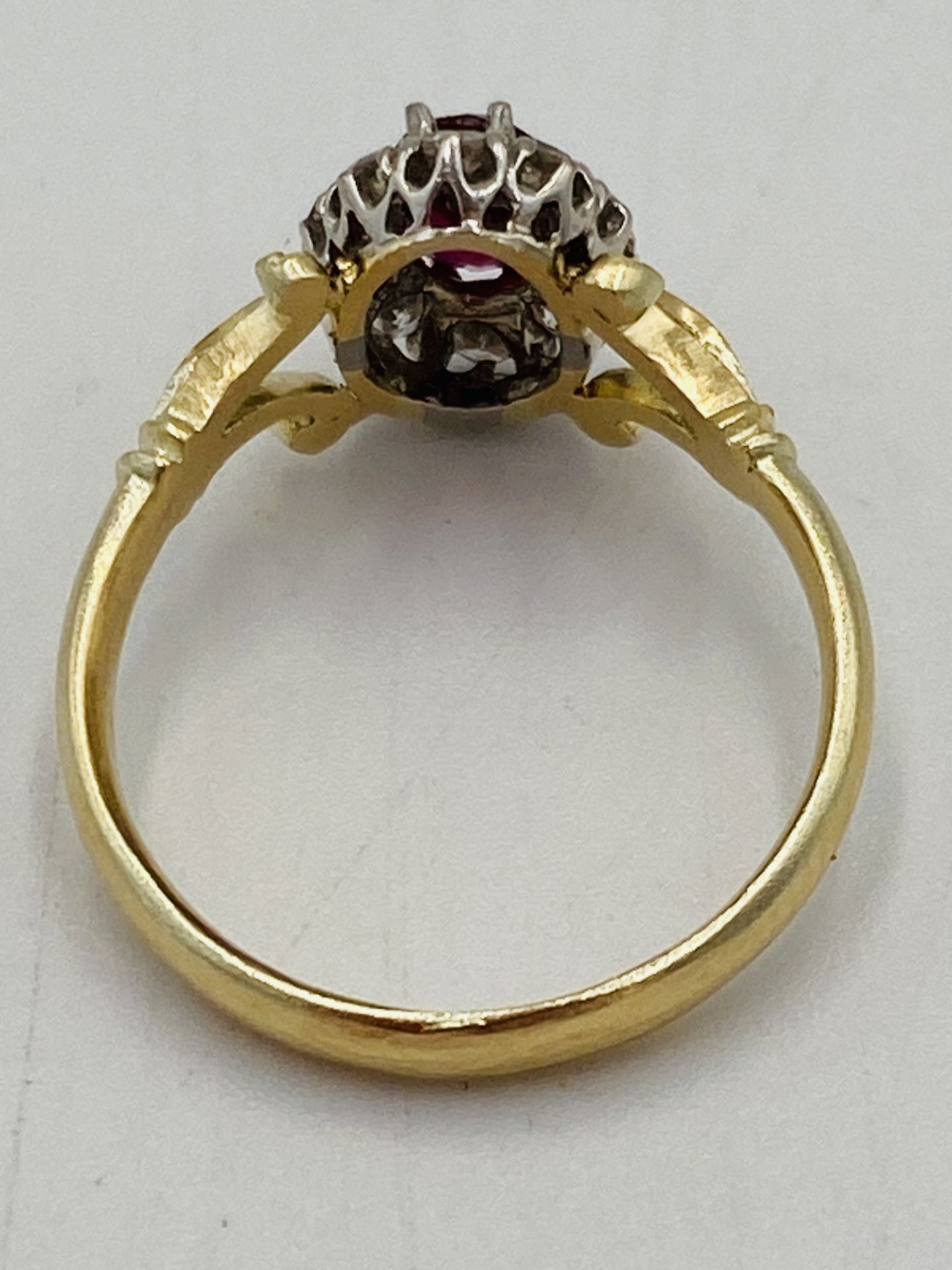 Gold ring set with central ruby and diamond surround - Image 4 of 6
