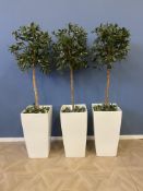 Three artificial trees in pots