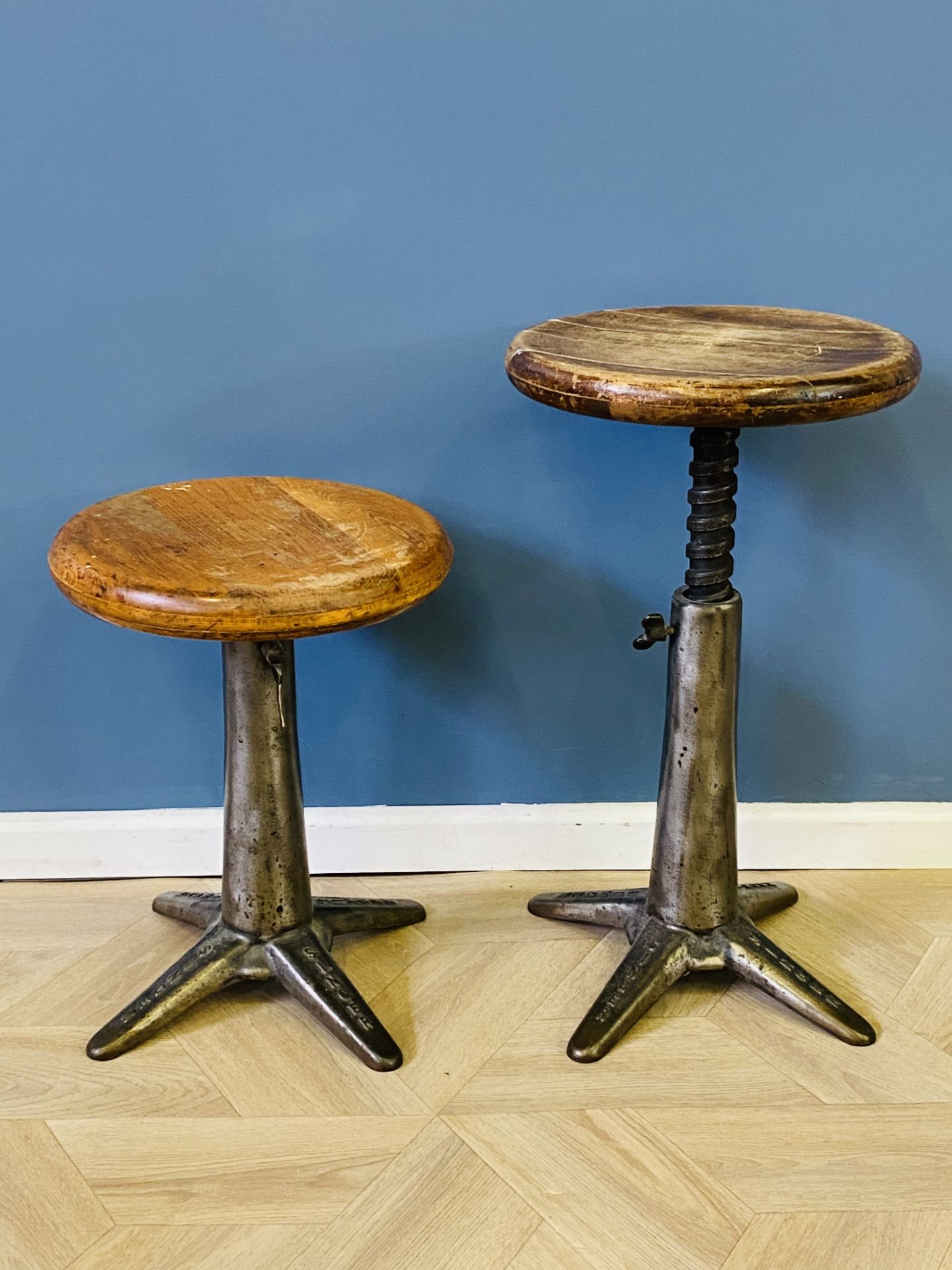 Pair of steel and cast iron 'Singer' industrial factory stools