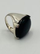 Silver ring set with an onyx stone