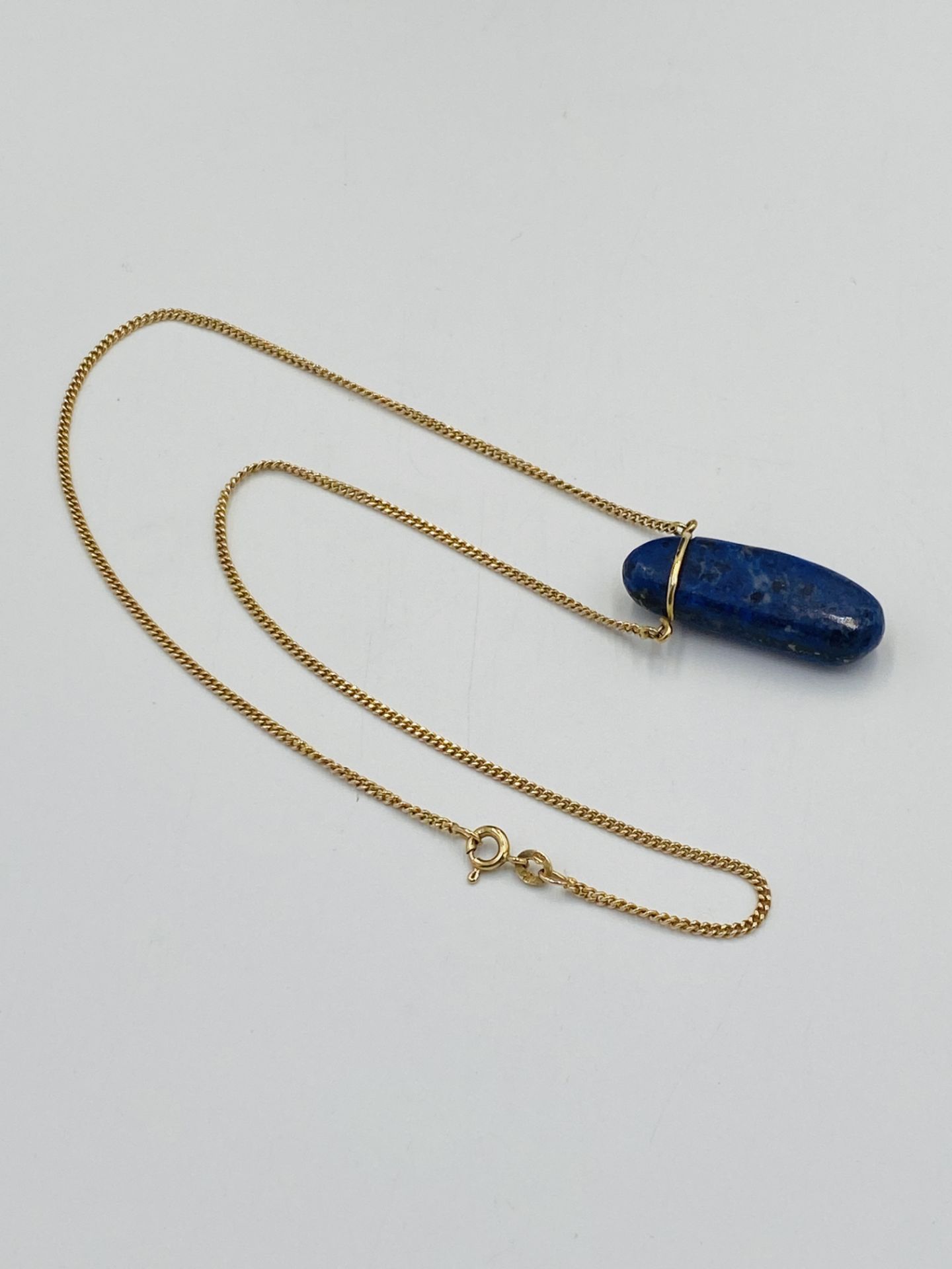 9ct gold necklace with a lapis pendant