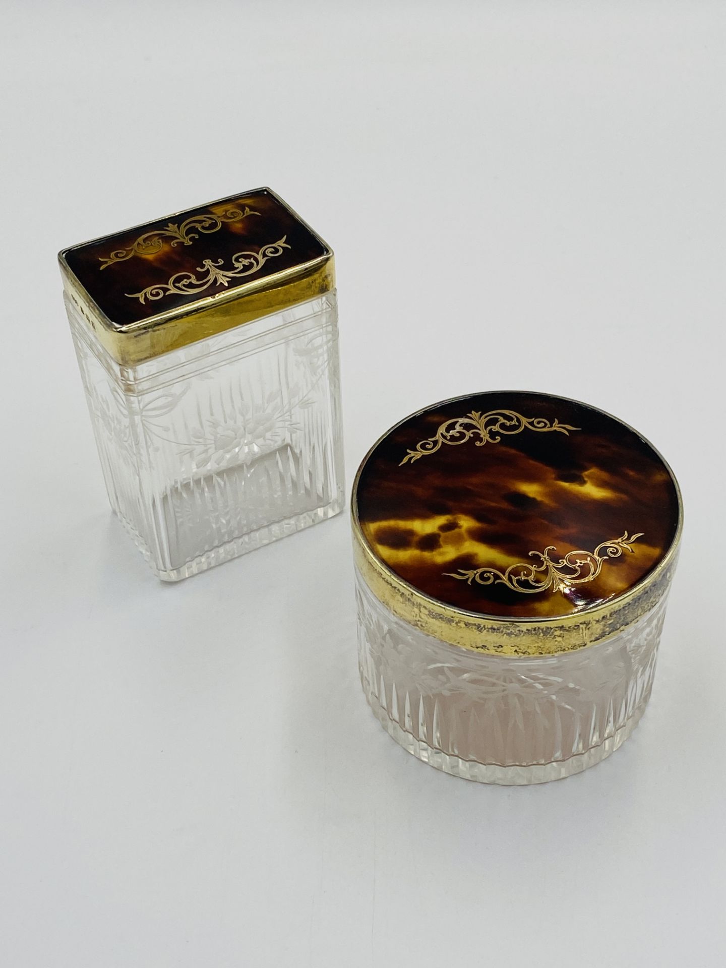 Two silver and tortoiseshell dressing jars