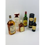 Three bottles of whisky together with a bottle of sherry