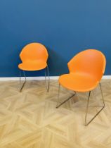 Pair of smile Italian orange plastic chairs